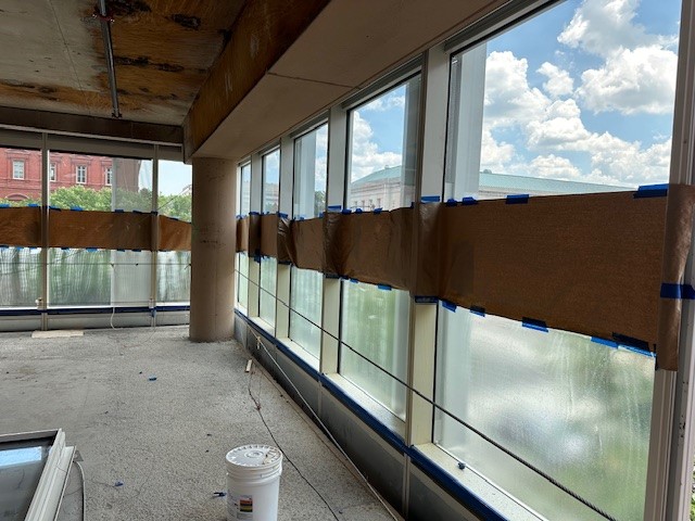 Curtainwall protective coating installation during construction